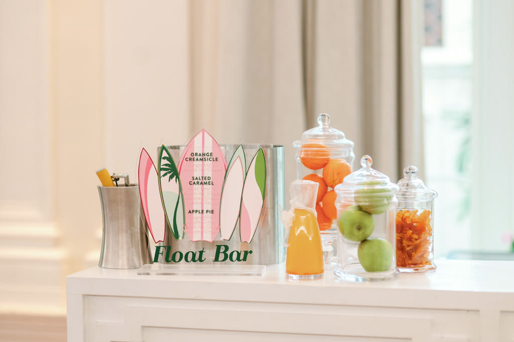 Float Bar sign cut as surfboards beside apothecary jars of fruit and candy