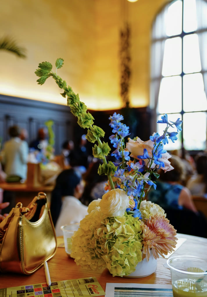 Blue delphinium and hydrangea centerpiece on a cocktail table