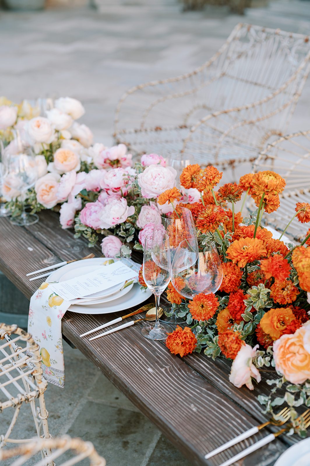 Peach and orange dahlia floral runner on a farm table